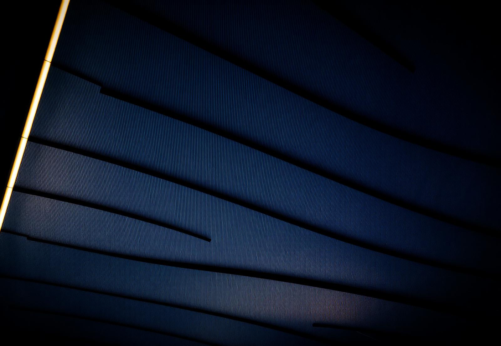 Abstract architectural lines in navy and gold
