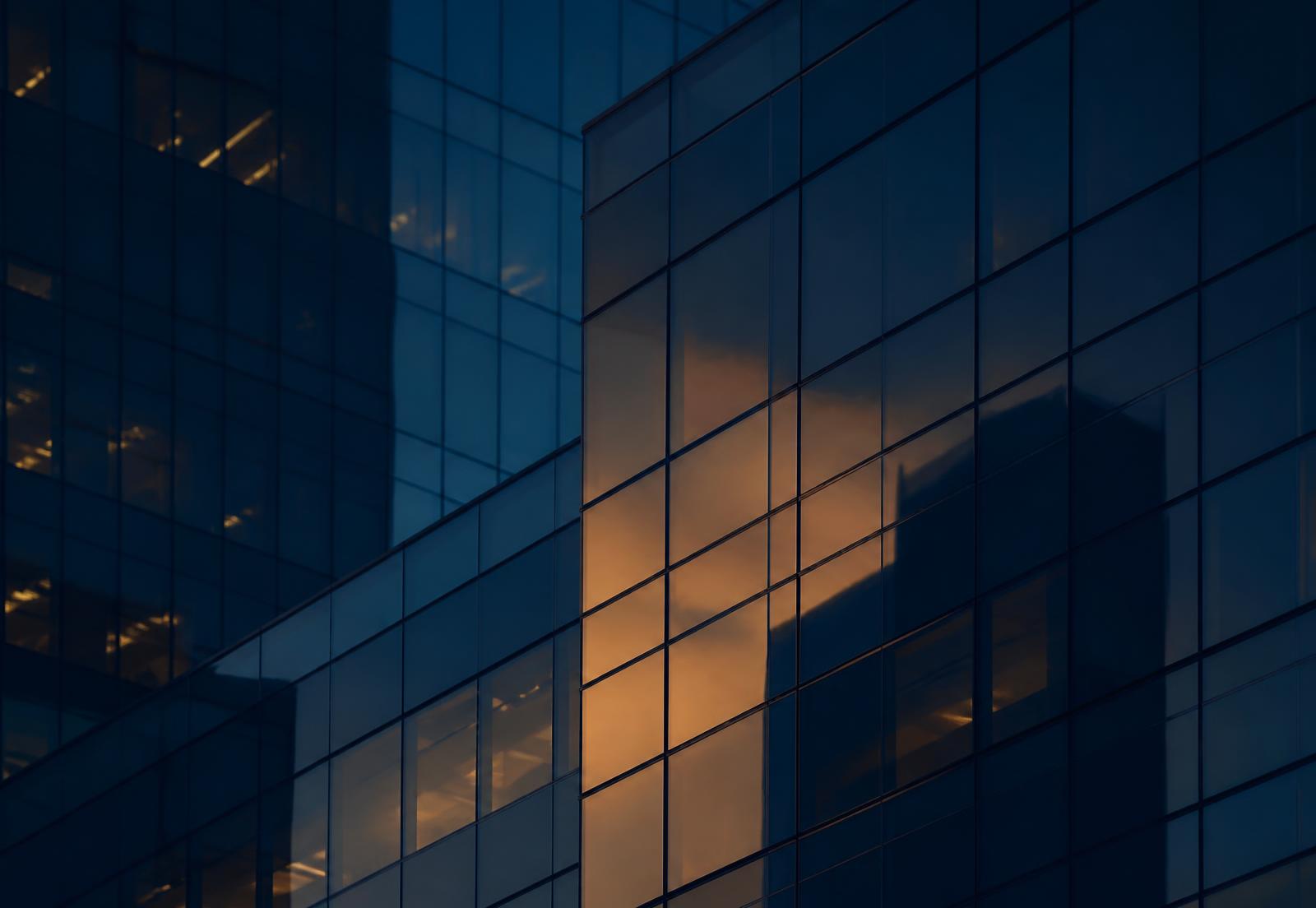 Glass office facade at dusk